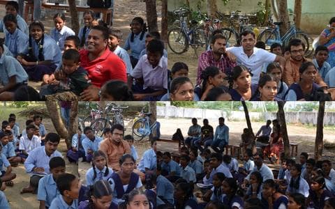 A TechieRide volunteer leading an interaction session with school students