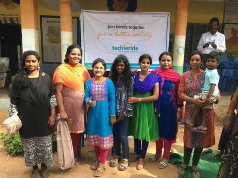 Women volunteers at a government school event